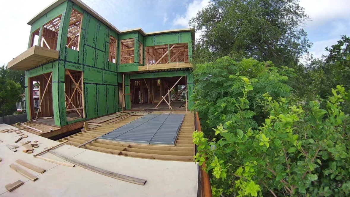 Sunny Waves Lake Dunlap home framing complete with first round of siding