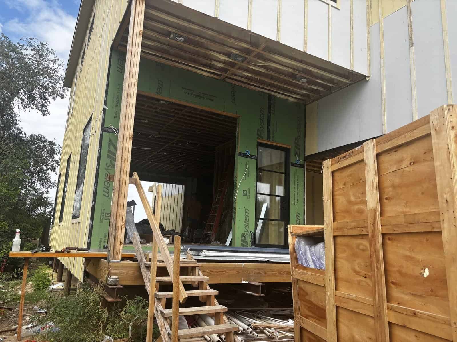 New exterior siding going up on the Sunny Waves lake house in New Braunfels
